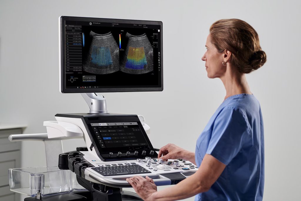 Ultrasound technician operating medical device